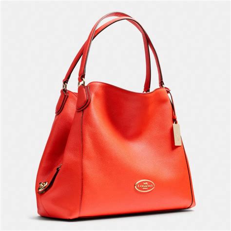 orange leather purse coach|orange coach bucket bag.